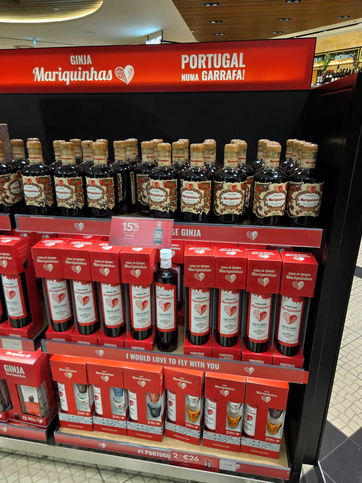 The Ginja Mariquinhas cherry liqueur stand with a 15% off price tag